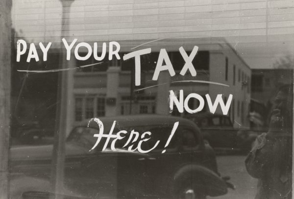 Window display showing "Pay your tax now here!"